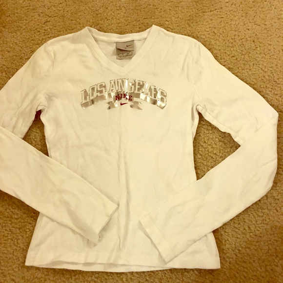 white and silver nike shirt